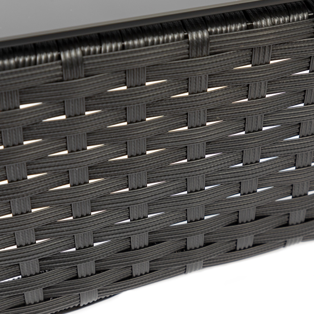 Close-up of black rattan pattern on patio furniture