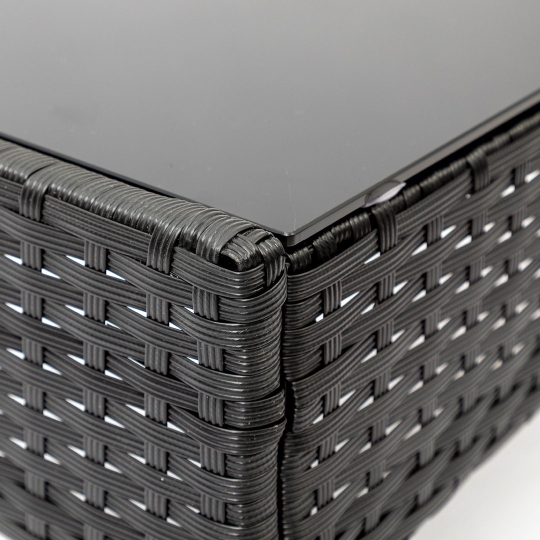 Close-up of black rattan pattern on patio furniture