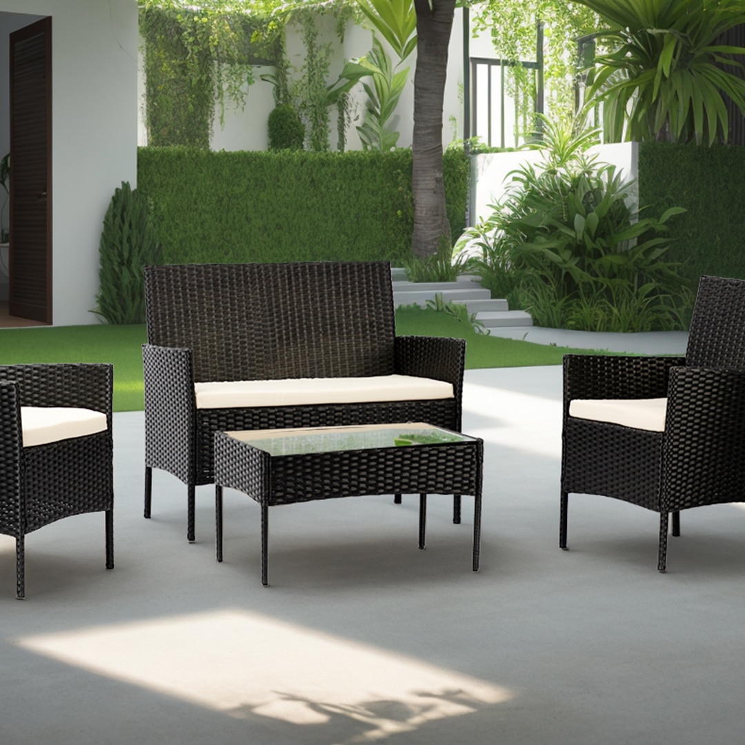 Black rattan chair and table set in a modern patio