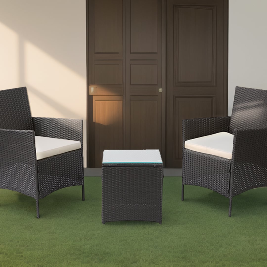 Brown rattan chair and table set in a garden